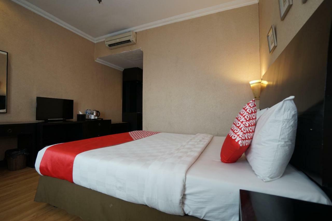 Capital O 1128 Hotel Imara Palembang Extérieur photo
